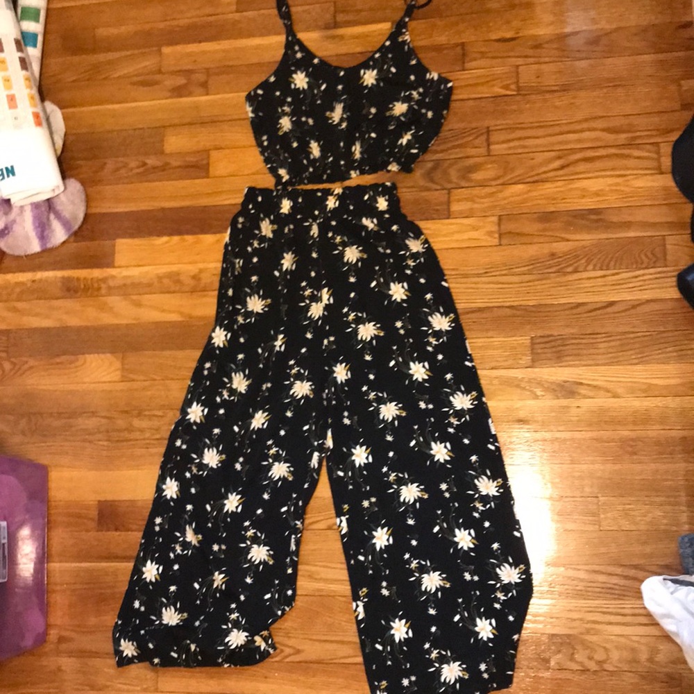 Black top with matching pants, floral patterns